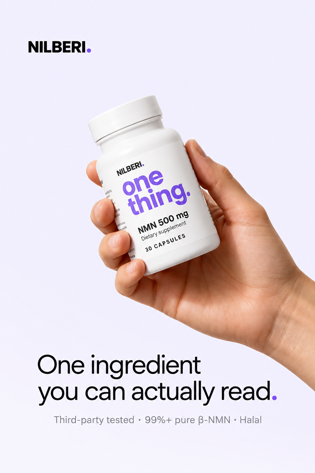 Hand holding a NILBERI NMN 500 mg bottle: one ingredient you can actually read